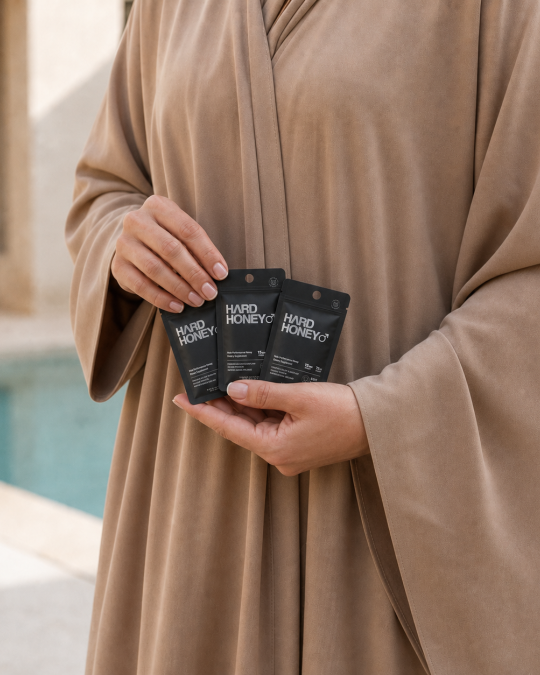 Person holding Hard Honey pouches